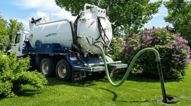 Professional vacuum truck performing residential drainage and septic maintenance in Indianapolis, IN